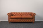Sofá Chesterfield cojines cuero